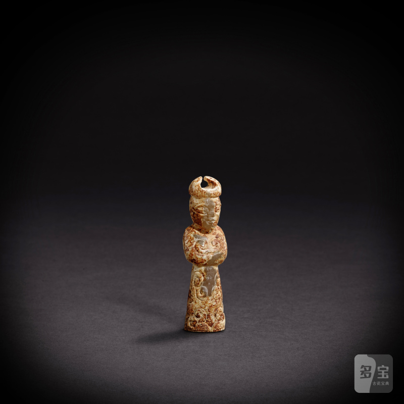 A white and russet jade 'figure' pendant, Eastern Zhou dynasty, Warring States period | 東周戰國 白玉人像墜